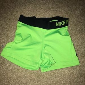 green nike pros